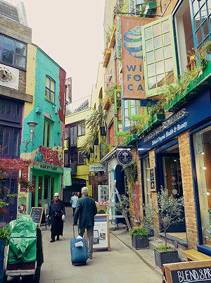 Colourful shopping district with brightly coloured shop fronts in Covent Garden