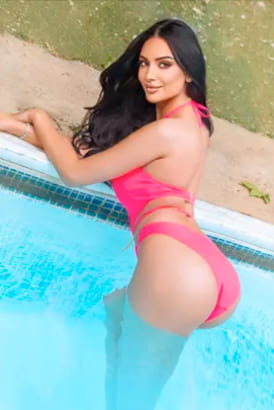 Black haired sexy girl in a pink bikini