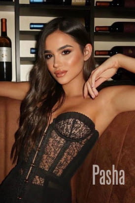 Dark haired young Latin girl in a black lace basque